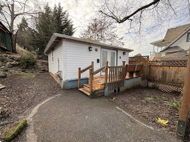 rear view of property featuring french doors