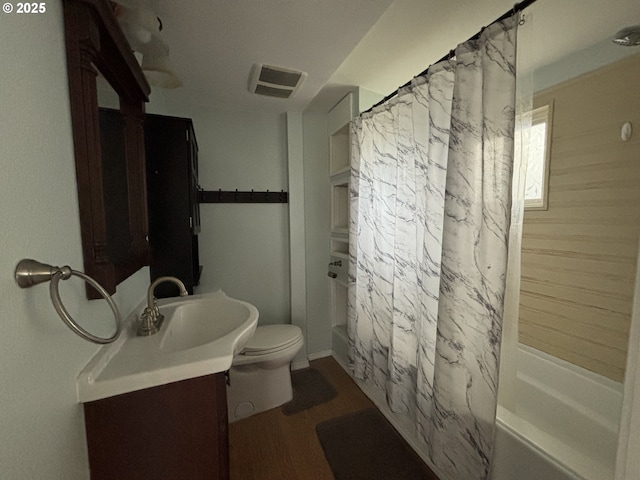 full bathroom with vanity, toilet, shower / bathtub combination with curtain, and wood-type flooring