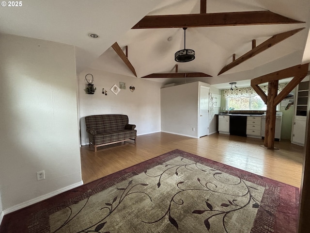 interior space featuring hardwood / wood-style floors and lofted ceiling with beams