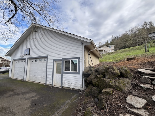 view of side of property with a garage