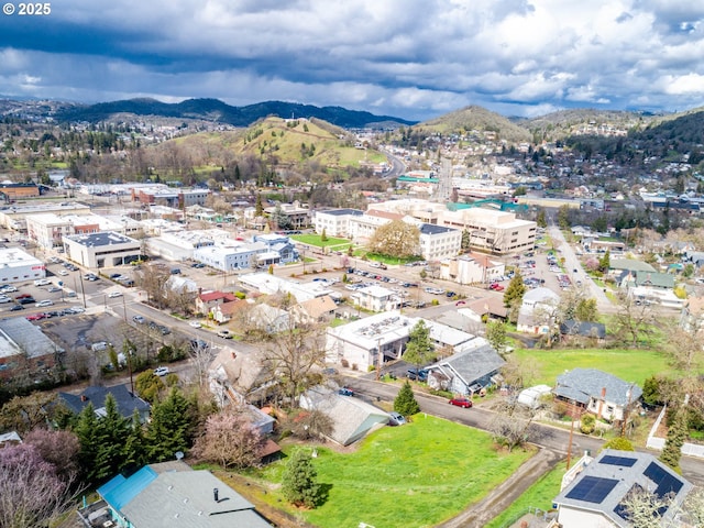 drone / aerial view featuring a mountain view