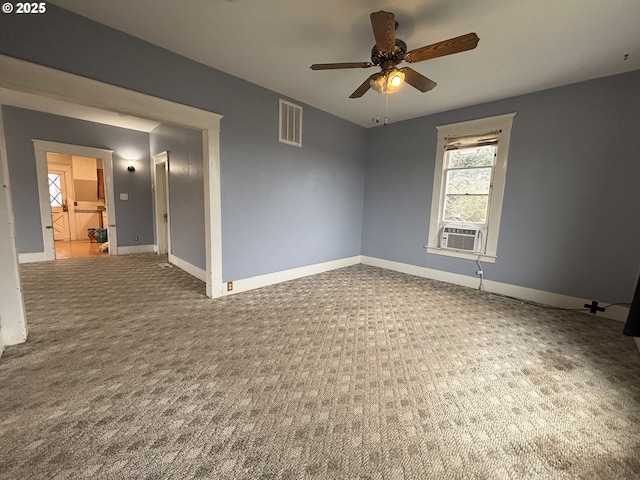 carpeted empty room featuring ceiling fan and cooling unit