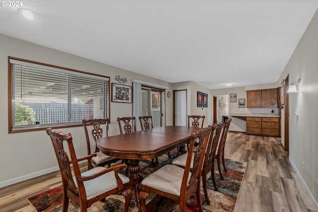 dining space with light wood-type flooring