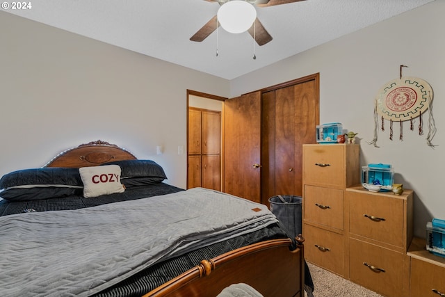 carpeted bedroom featuring a closet and ceiling fan