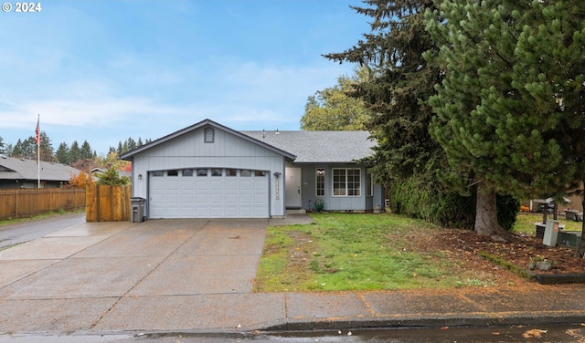 ranch-style home with a front yard and a garage