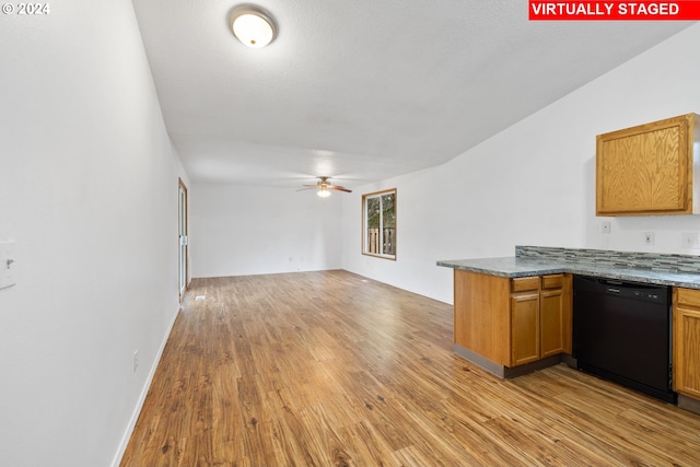 kitchen featuring black dishwasher, light hardwood / wood-style flooring, kitchen peninsula, and ceiling fan