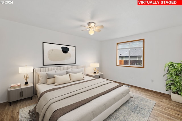 bedroom featuring hardwood / wood-style floors and ceiling fan