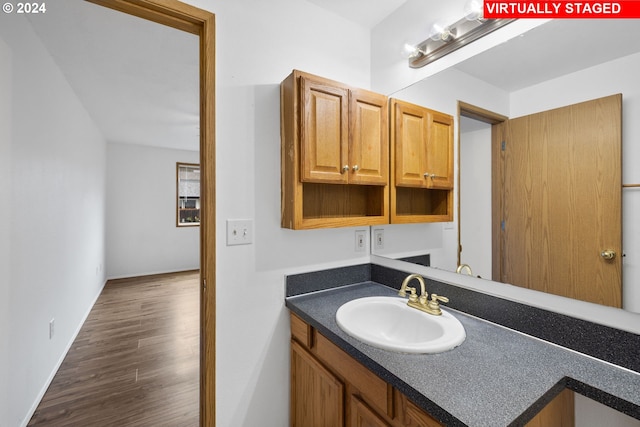 bathroom with vanity and hardwood / wood-style flooring