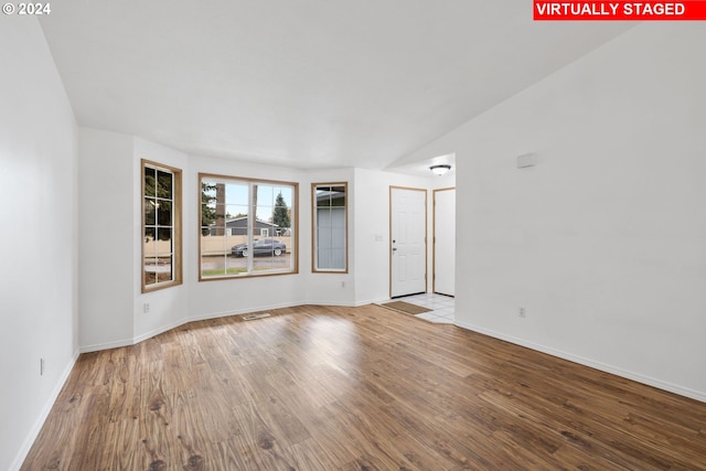 unfurnished room featuring light hardwood / wood-style flooring