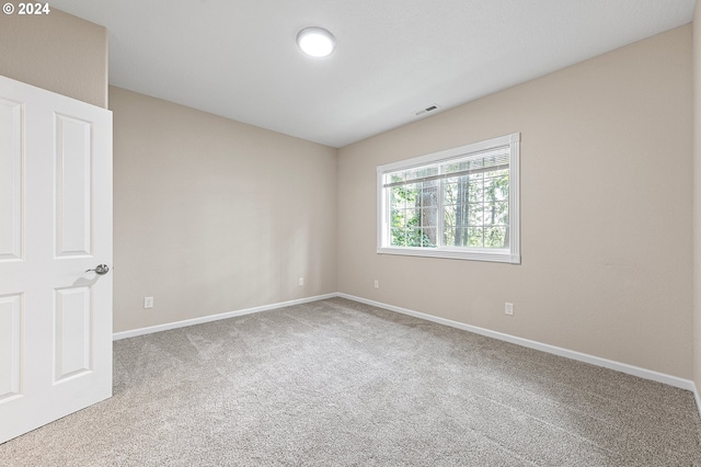 unfurnished room with carpet floors