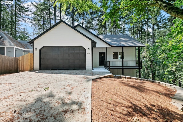 view of front facade with covered porch and a garage