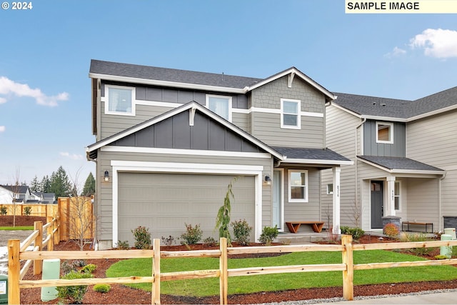 craftsman inspired home with a front lawn