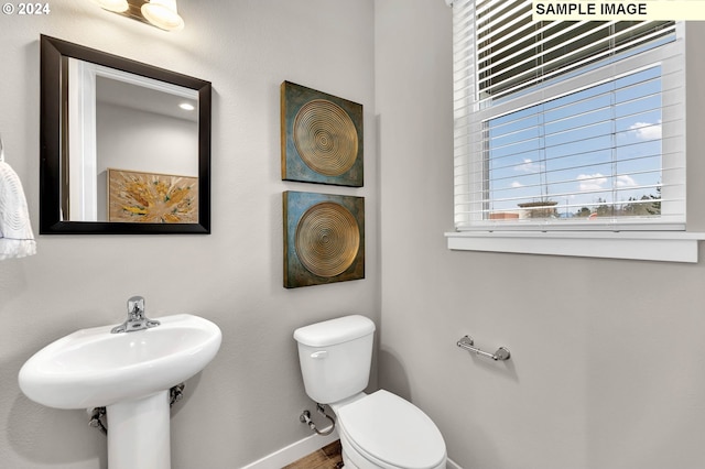 bathroom featuring sink and toilet