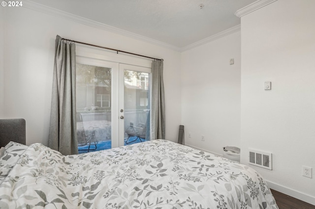 bedroom with dark hardwood / wood-style floors, access to exterior, ornamental molding, and french doors