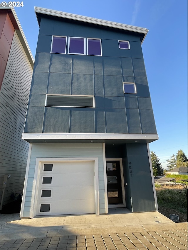 view of front of property with a garage