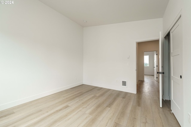 spare room with light hardwood / wood-style floors