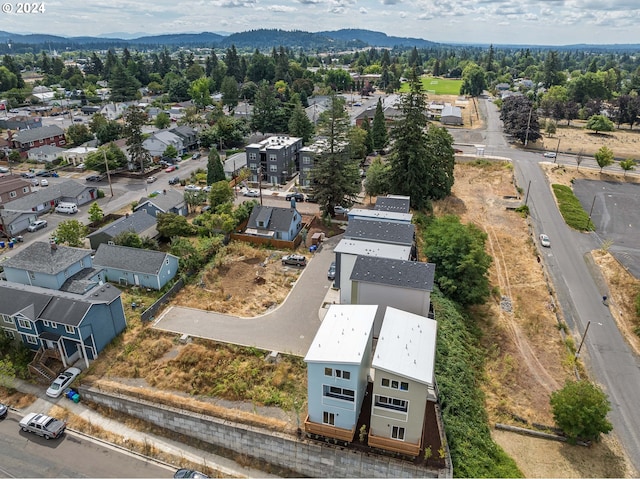 birds eye view of property with a mountain view