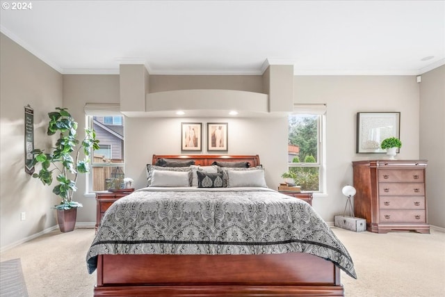 carpeted bedroom featuring crown molding