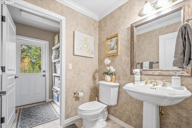 bathroom with tile patterned floors, toilet, and ornamental molding