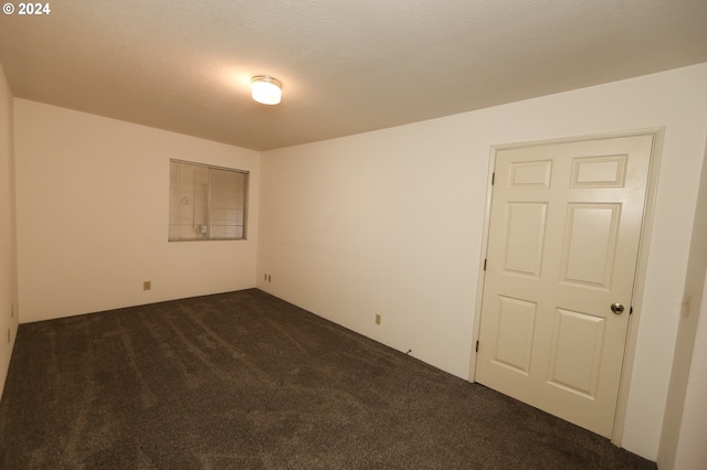 542 Pacific Ave, Brookings, OR 97415 - unfurnished room with dark colored carpet