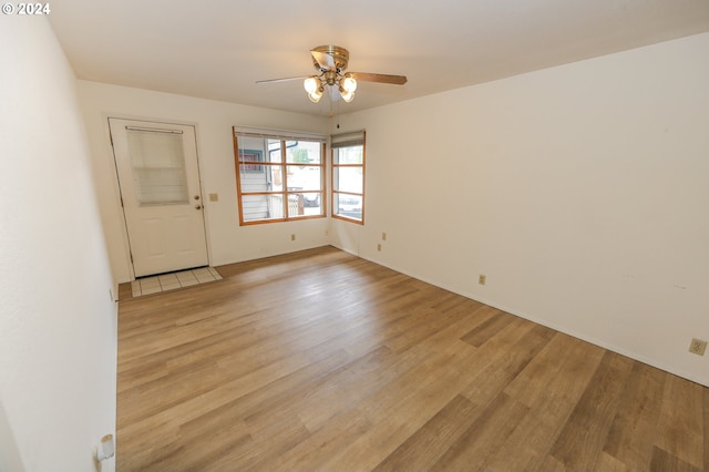 542 Pacific Ave, Brookings, OR 97415 - empty room with light wood-style floors, ceiling fan, and baseboards