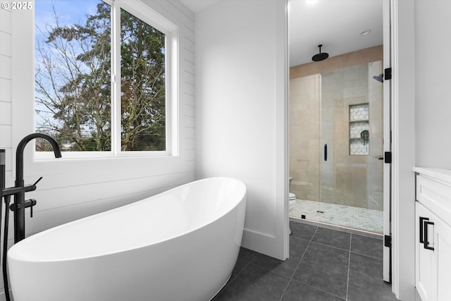 full bathroom featuring vanity, toilet, independent shower and bath, and tile patterned flooring