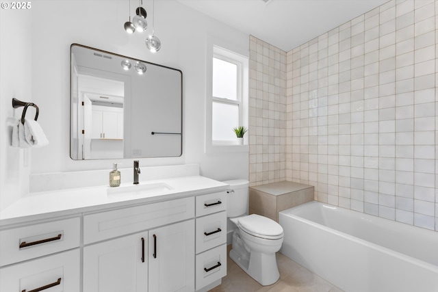 bathroom with vanity, tile patterned floors, and toilet