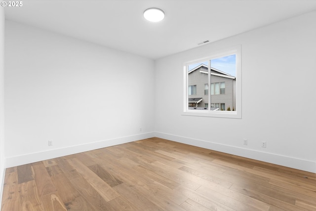 spare room featuring light hardwood / wood-style floors