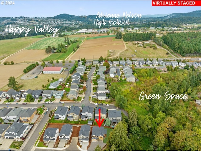 drone / aerial view featuring a mountain view