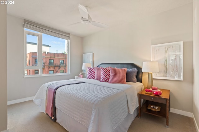 bedroom featuring ceiling fan and light colored carpet