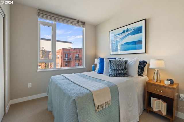 bedroom featuring light colored carpet