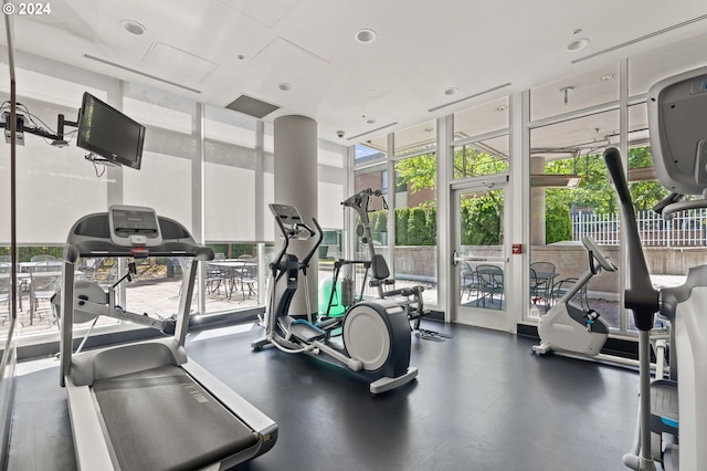 exercise room featuring floor to ceiling windows