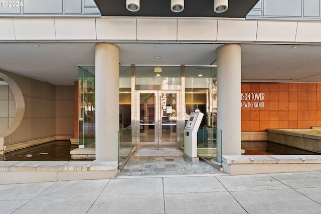 view of exterior entry featuring french doors