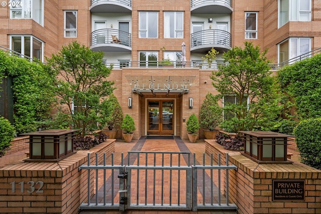 view of patio / terrace with french doors and a balcony