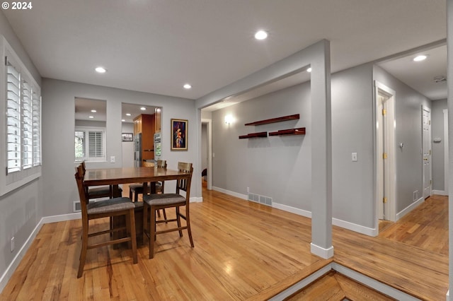 dining space featuring light wood-type flooring