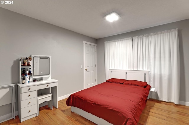 bedroom featuring light wood-type flooring