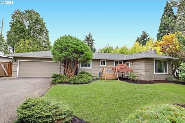 single story home with a front lawn and a garage