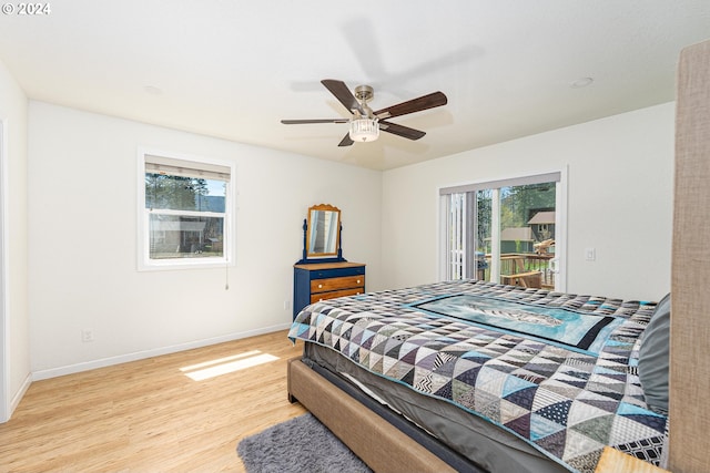 bedroom with access to exterior, light wood-style flooring, baseboards, and a ceiling fan