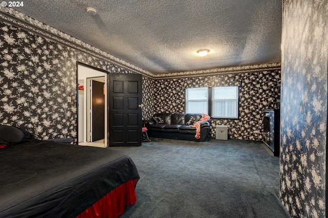 bedroom featuring lofted ceiling, carpet floors, and a textured ceiling