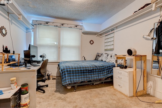 carpeted bedroom with a textured ceiling