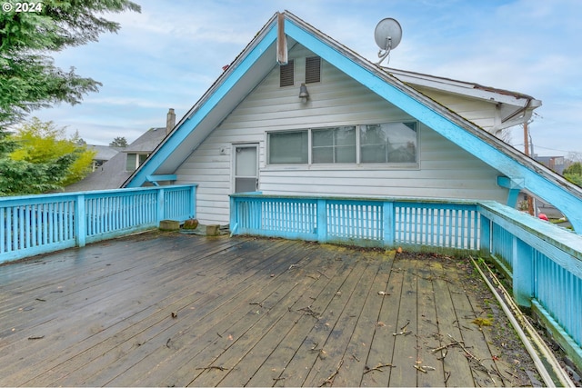 rear view of house with a wooden deck