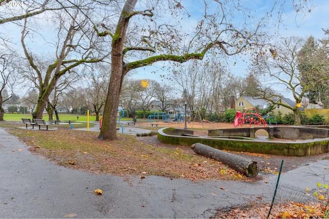 view of property's community with a playground