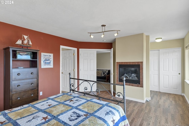 bedroom featuring hardwood / wood-style floors and a closet