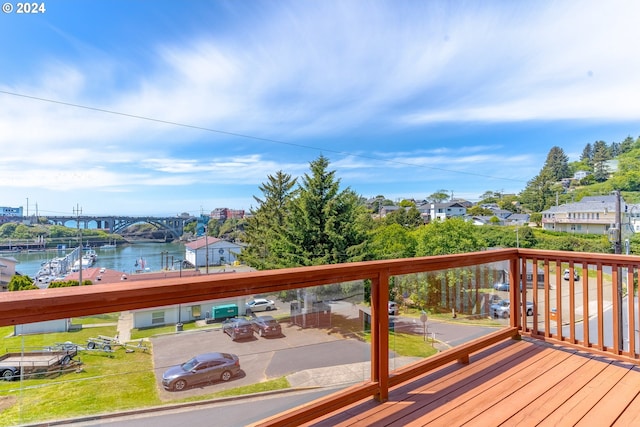 wooden deck featuring a water view