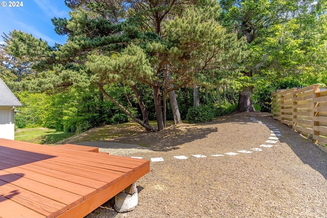 view of yard featuring a wooden deck