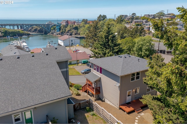 birds eye view of property with a water view