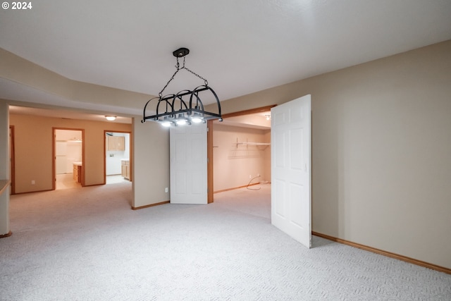 unfurnished dining area featuring carpet floors