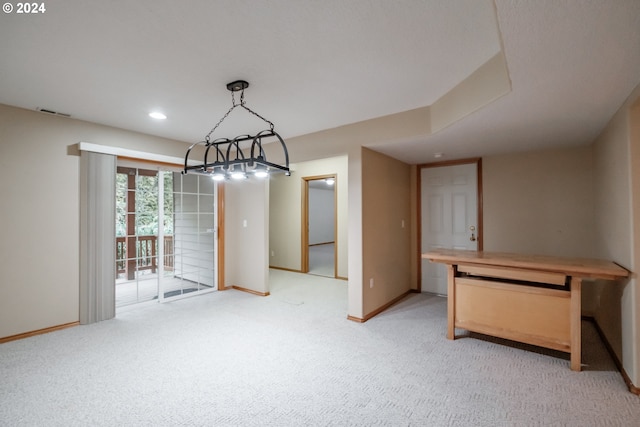 unfurnished dining area featuring light carpet