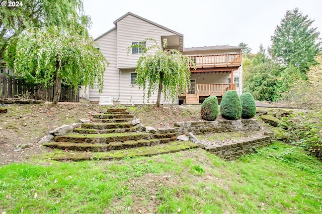 back of house featuring a wooden deck