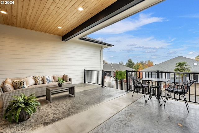 view of patio / terrace with an outdoor living space and a balcony